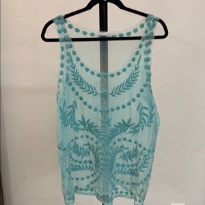 Light blue sheer sleeveless blouse